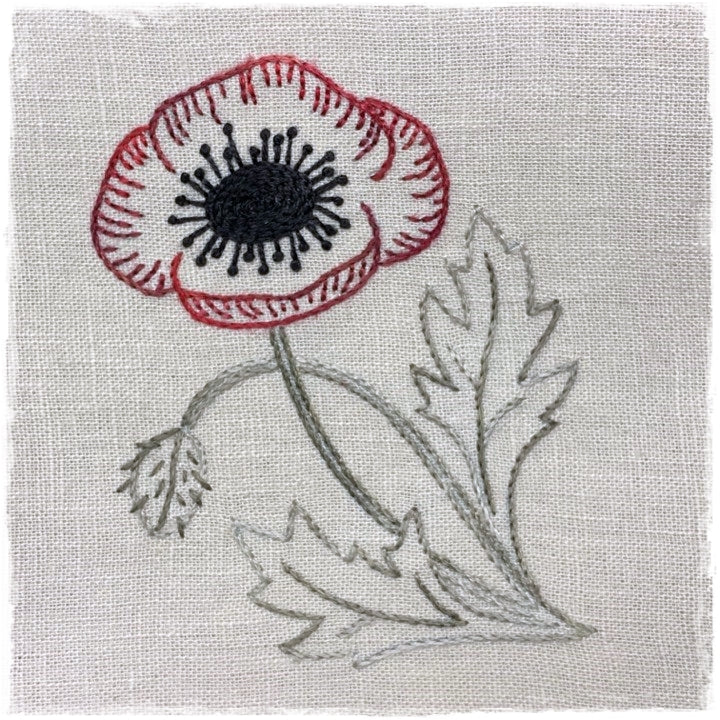 needlecraft pattern for a poppy flower design on a linen background, with red and white color details.