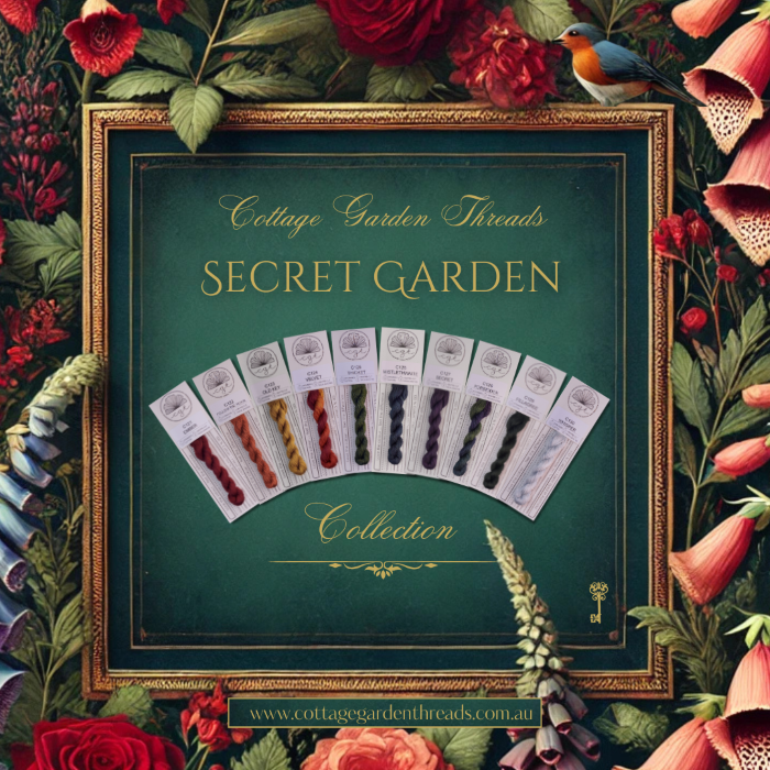 Photo of Cottage Garden Threads Secret Garden Collection styled with flowers and a robin.