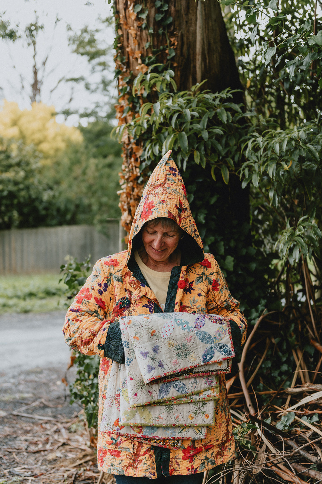 Veronique holding her quilts