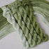 Four twisted embroidery threads in a gradient pack of clover green from light to dark.