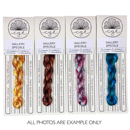 Embroidery thread with speckle effect in autumnal yellows and browns, fall russet reds, maroon and blue, ocean aqua and blue.
