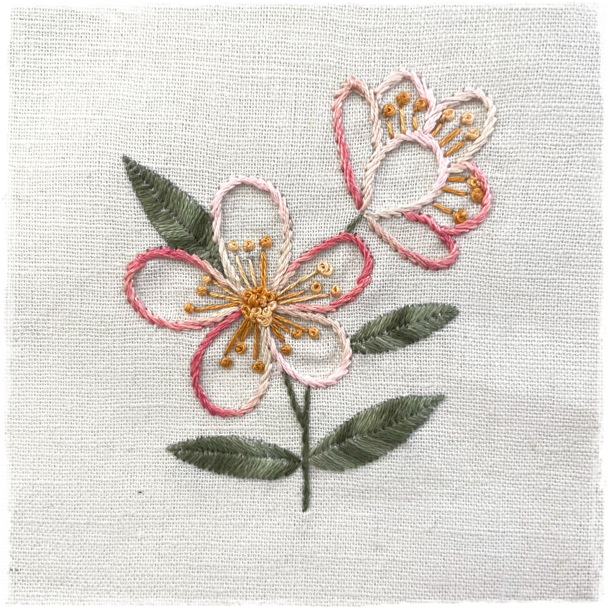 needlecraft pattern for a flower design on a linen background, with color instructions and stitching samples