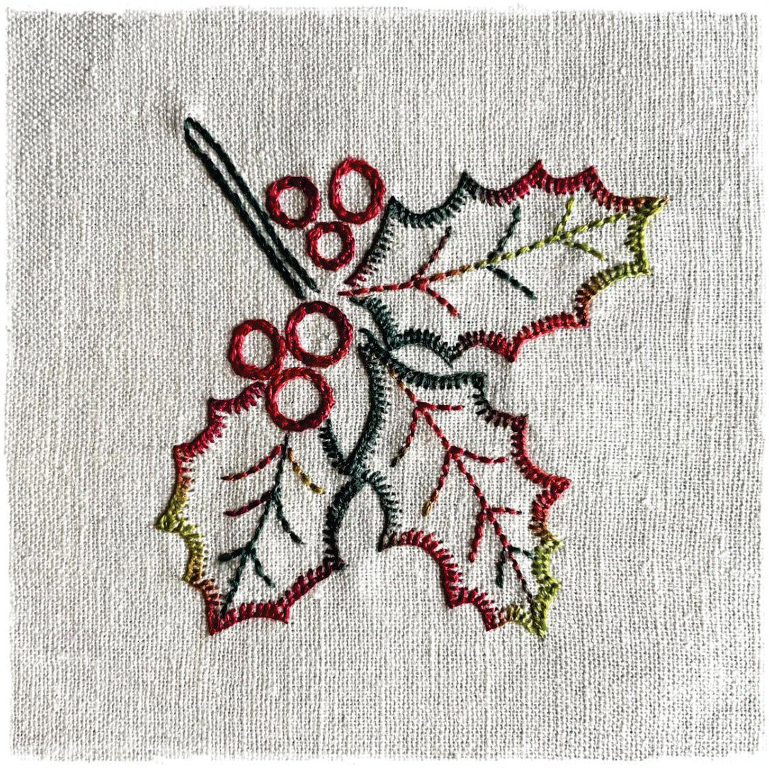 needlecraft pattern for a decorative journal page featuring a stylized leaf design with red and green details on a white background.