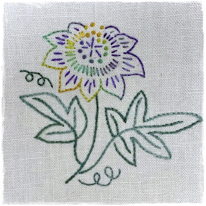 needlecraft pattern for a purple and green floral design on a linen background, labeled as &