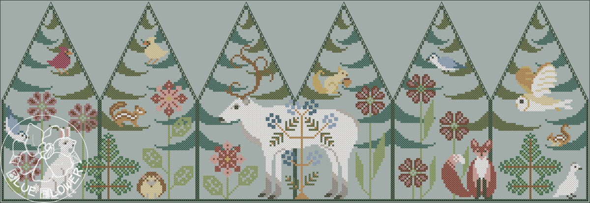 cross-stitch design of a forest scene with pine trees, a white reindeer, birds, flowers, and a fox