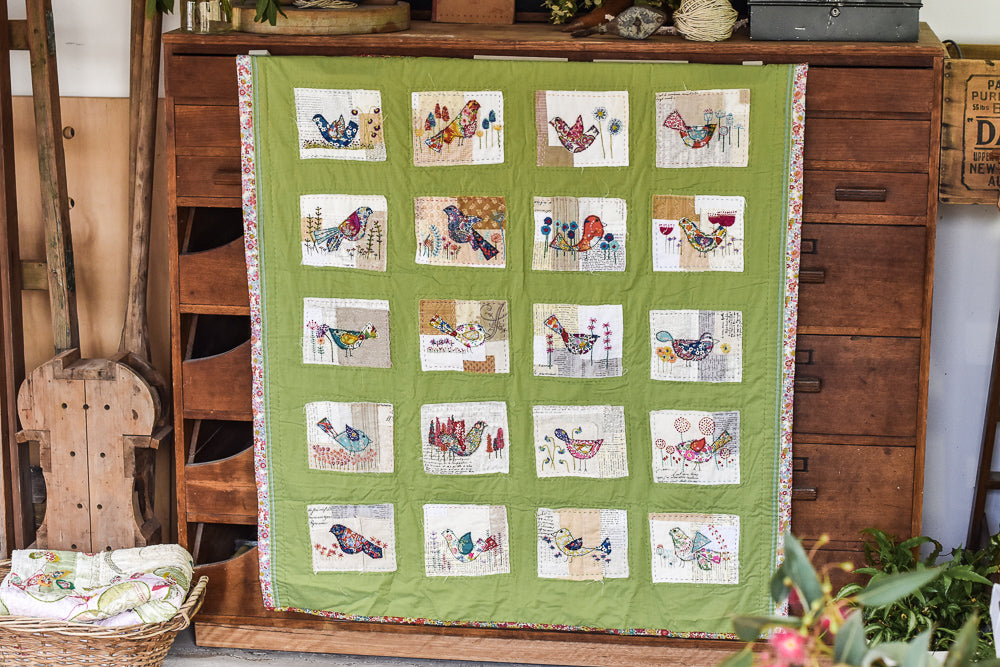 Completed embroidery quilt by Lisa Mattock of birds
