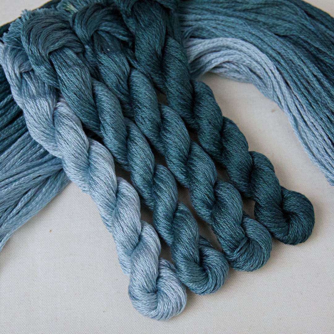 An embroidery thread pack in the colour Teal, with shades from pale to dark. From Cottage Garden threads