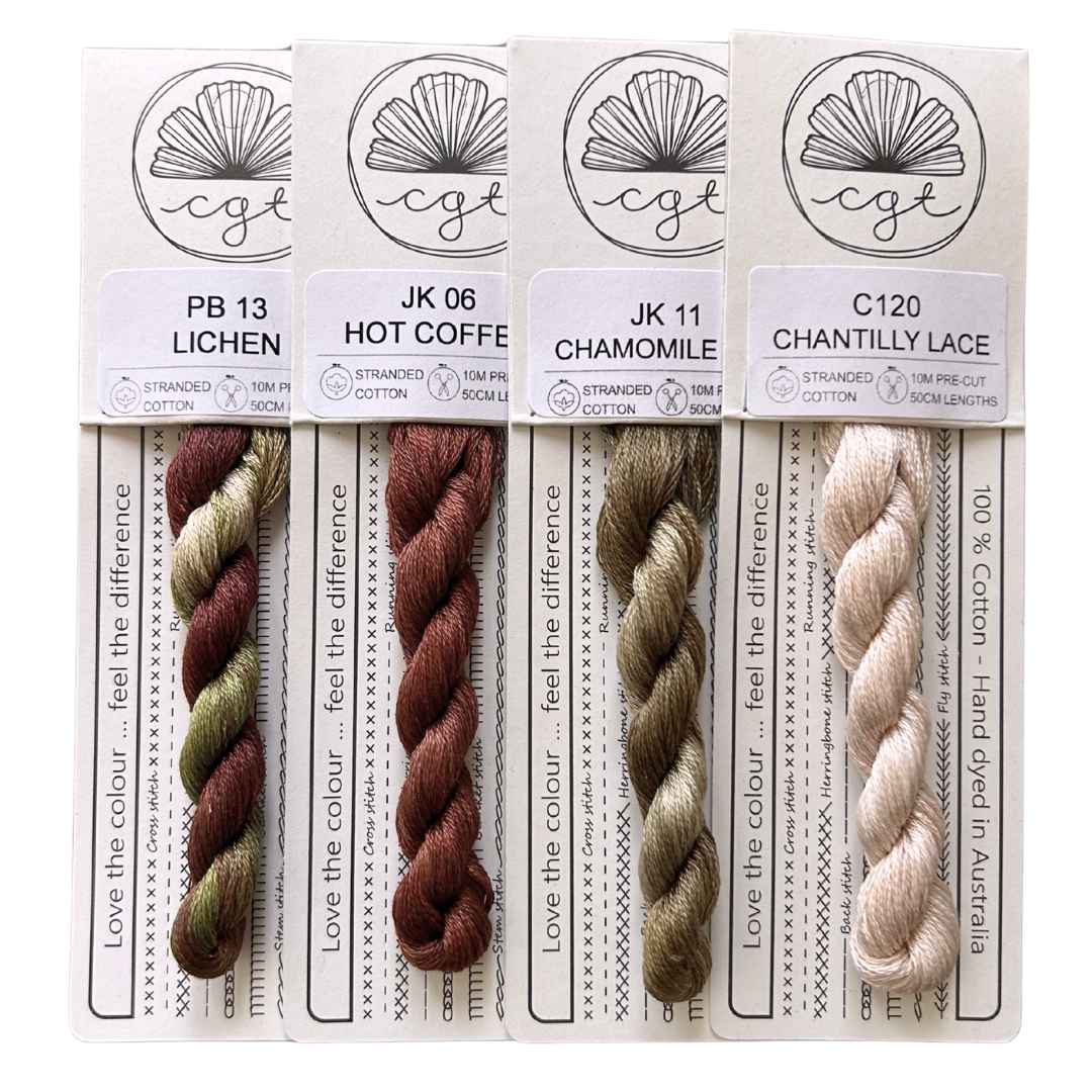 Four packaged cotton embroidery thread skeins shown side by side.