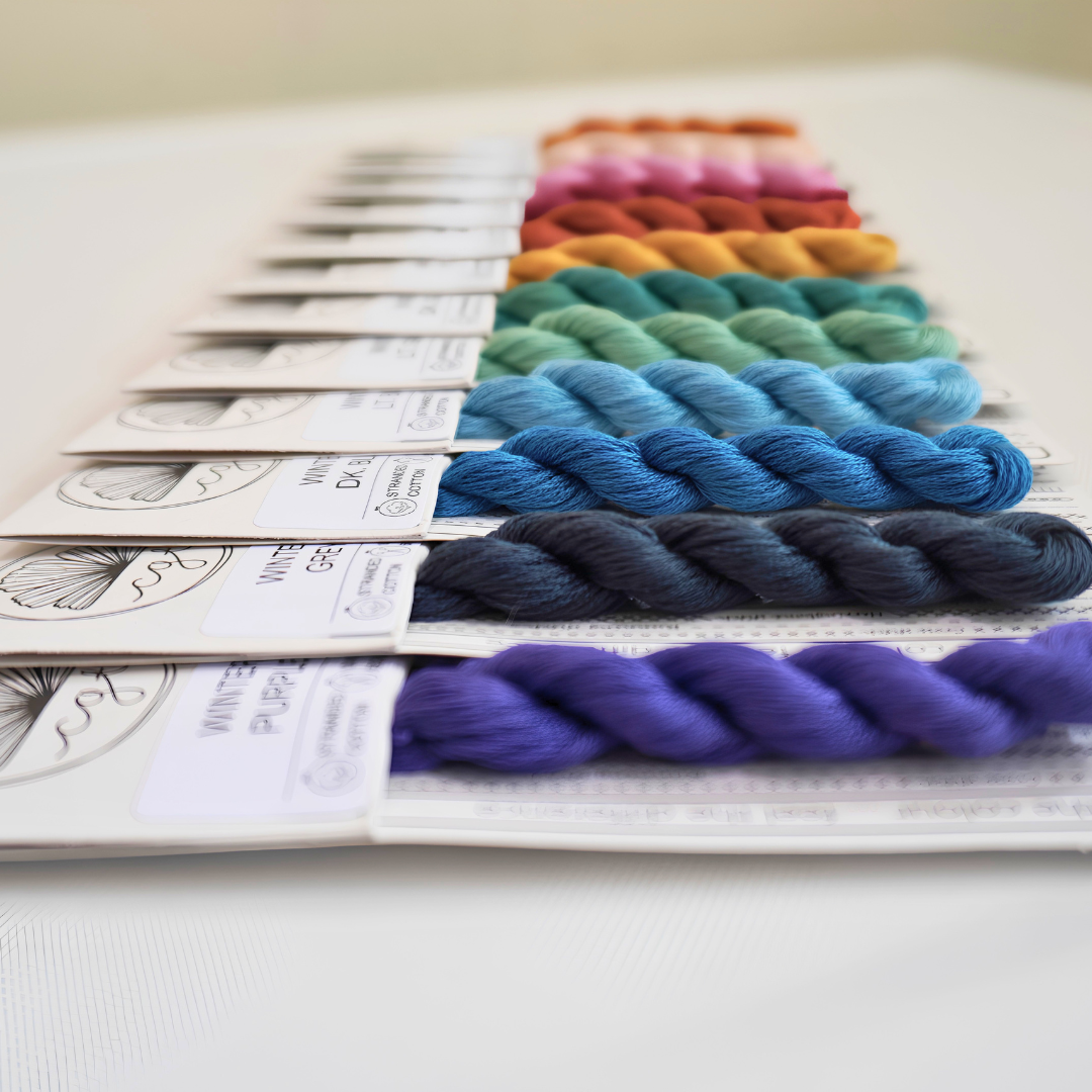 side view of winter range rainbow embroidery threads