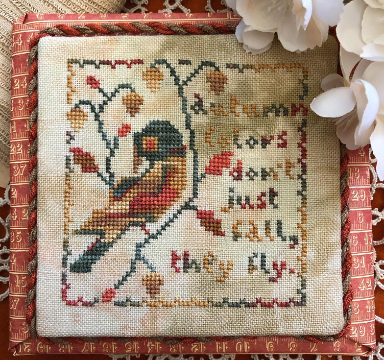 Autumn colour palette cross-stitch sign that says Colours don't just fall they fly with a picture of a bird